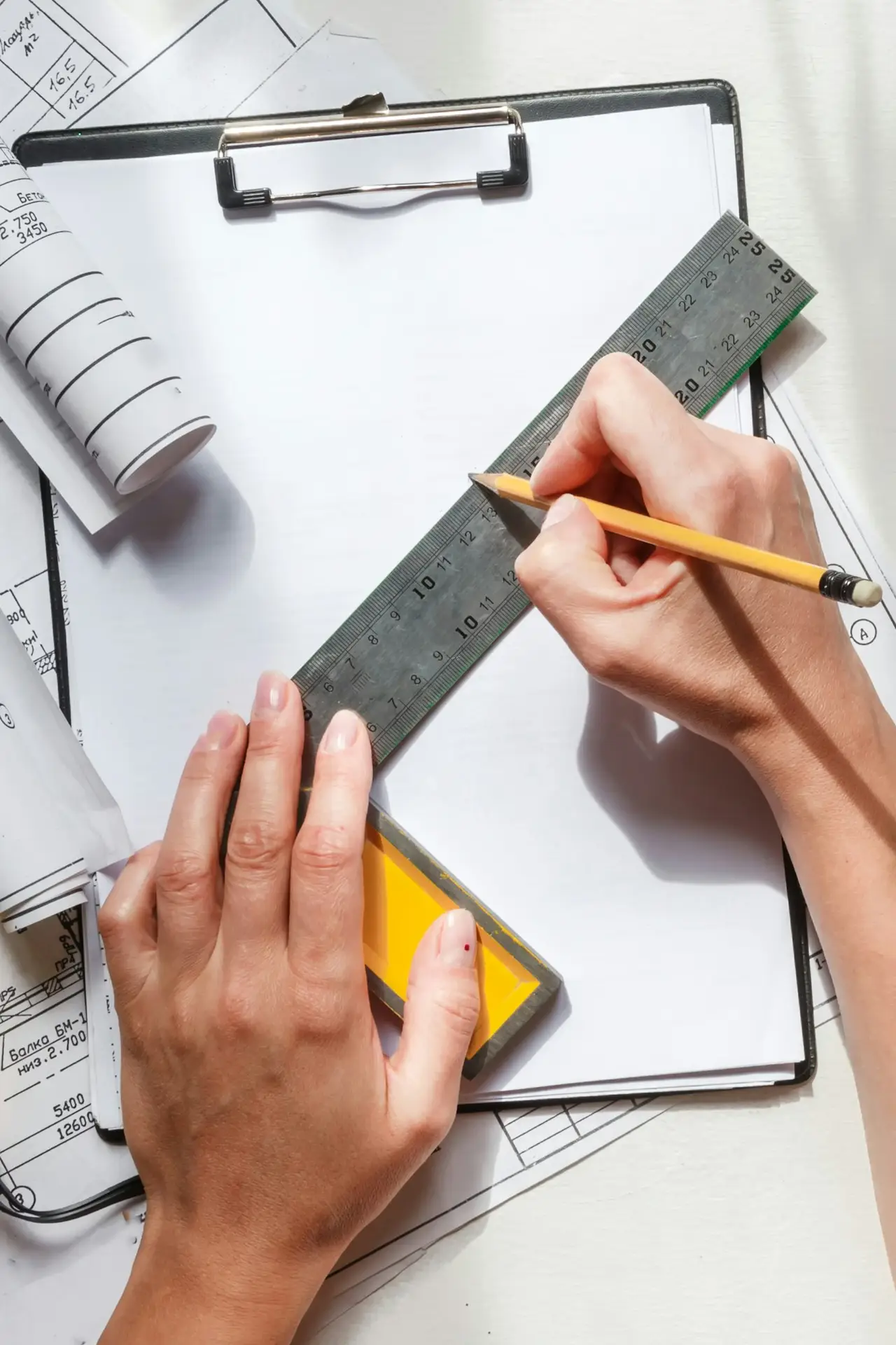 architect design working drawing sketch plans blueprints and making architectural construction model